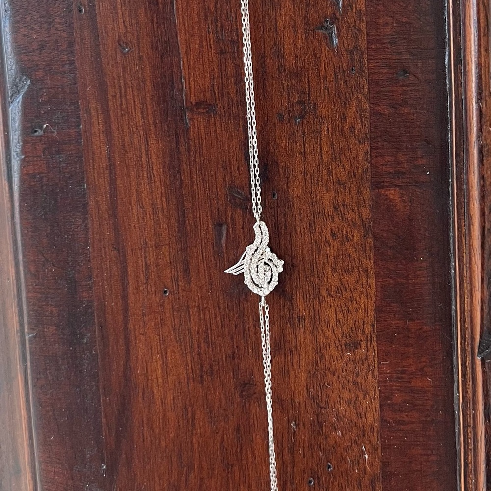 Elegant Silver Bracelet with Intricate Zirconia Design